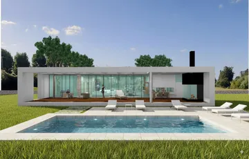 Quincho con grandes ventanales plegadizos que se integran al jardín